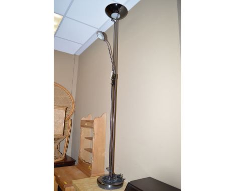A modern chrome coloured metal uplighter and spot standard lamp.
