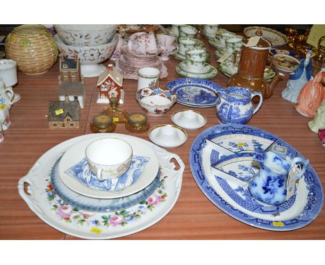 A Royal Worcester brown earthenware tea pot; a Coalport red house; three Denby Village houses; a floral decorated two-handled