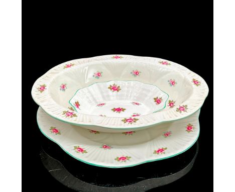 White bone china plates with pink rose motif, light turquoise rim. Serving bowl 9.5"L x 9.25"W x 1.75"H, plate 0.75"H x 9.25"