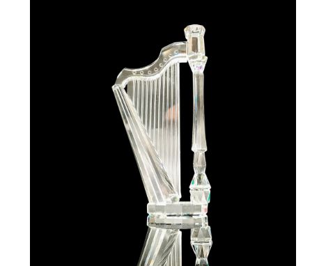 Sparkling faceted and molded crystal figurine modeled as a pedal harp. Swarovski acid marks. This item has its original box. 