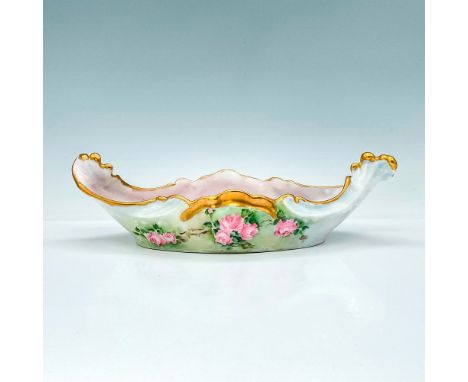 This gorgeous canoe shaped dish with crashing wave-like handles, pink and green finish, is decorated with hand painted pink r