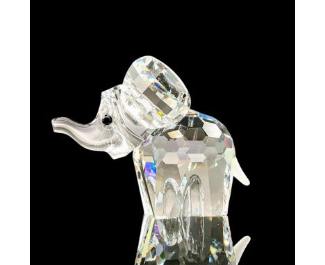 Adorable faceted miniature crystal figurine modeled as a baby elephant. Swarovski acid marks. This item has its original box.