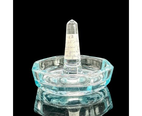 Clear light blue pressed glass ring holder with textured segments. Dimensions: 2.5"H x 3"diaCondition: Age related wear.
