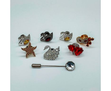 Beautiful assortment of pins with gold tone detail. Each pin is encrusted with Swarovski crystals. Crystal colors range from 