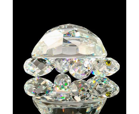 Sparkling faceted and molded crystal figurine modeled as a tortoise with green gem eyes. Swarovski acid marks. This item has 