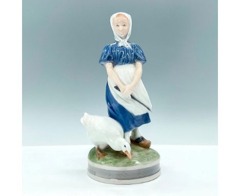 Beautiful figurine depicting young maiden with goose. Constructed of fine glassy porcelain and hand-painted mostly in blues a