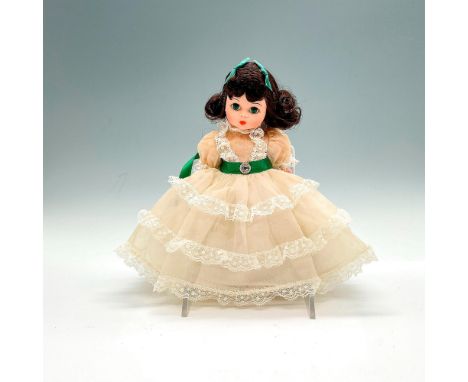 A children's version of Scarlett O'Hara. Doll is dressed in a white dress with green satin ribbons. Vintage item. This item h