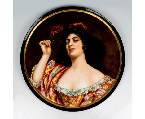A large, round tray featuring a hand painted portrait of a lady with costume mask in hand; gilded border. J. P. L France back