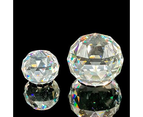 2 clear faceted orbs. Includes a small paperweight, and the other has a prismatic underside. Swarovski SCS etched markings. S
