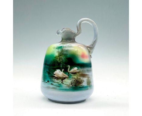 Small blue pitcher depicting two swans swimming around a lake. Vintage item. Royal Bayreuth backstamp. Dimensions: 3.5"L x 3.