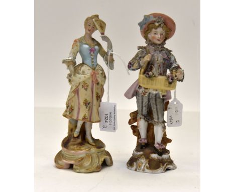 A Sitzendorf  porcelain figure of a flower seller, 20 cm high, together with a similar bisque figure of a lady with fan, 20 c