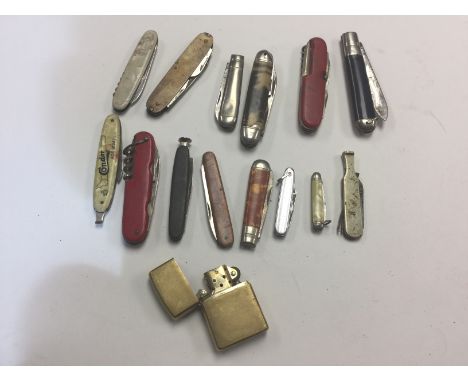 A collection of 14 Penknives and Fruit knives plus a brass bodied "Zippo" Cigarette Lighter marked to underside "E 14". (15)