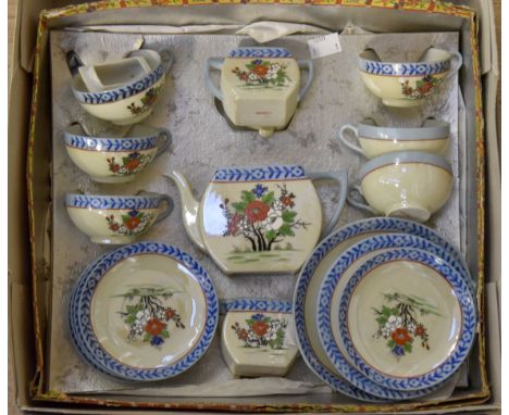 Circa 1930's Art Deco tea service with floral pattern, stamped "Foreign" to bases with part of the original box, some damage