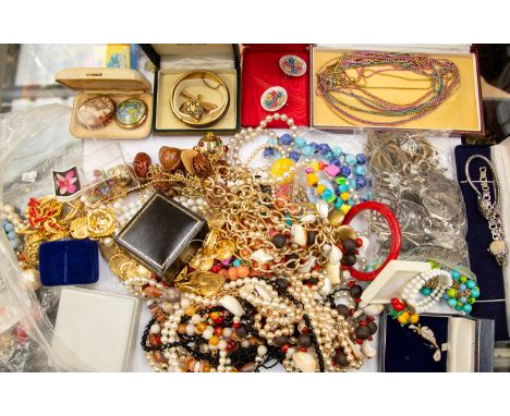 A collection of costume jewellery to include a Rafaelia flag brooch, scarf clips, an Italian gilt metal belt, enamel and gilt