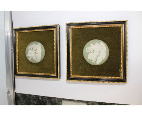 A Wedgwood green jasper round medallion of Aurora or The Goddess of Dawn. mounted in a black and gilt frame on a green velvet