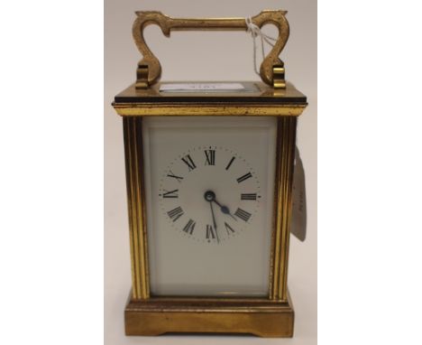 Late 19th Century brass carriage clock with white enamelled dial, black Roman numerals, four pillared movement - number A6658