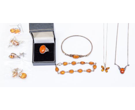 Silver and amber jewellery comprising an amber set ring, earrings, pendants and bangle (9)