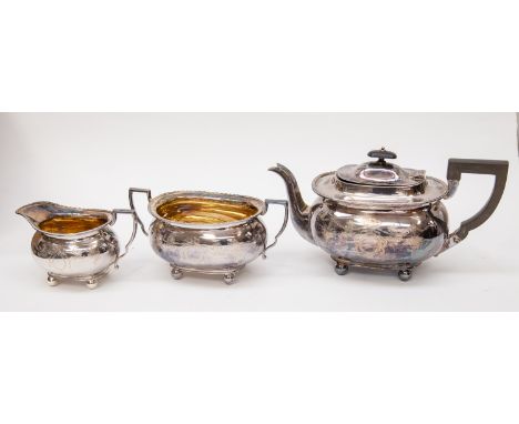 An Edwardian silver plate EPNS three piece tea service - James Deakin &amp; Sons, foliate and swag decoration 