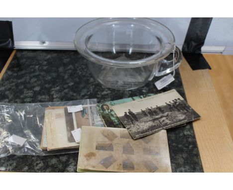 An unusual glass chamber pot, thought to be Tutbury, with a pulled handle and an etched 'chad' to the base, looking over a wa