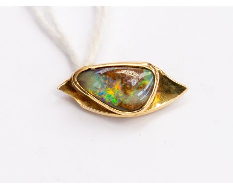 An 18ct gold and opal set brooch, triangular opal rub over set, length approx 20mm, total gross weight approx 3.7gms 