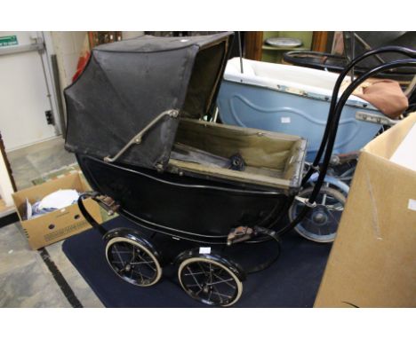 A Victorian style dolls black pram, possibly by the Silver Cross by Wilson together with another dolls pram (vintage) painted