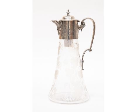 A Victorian silver mounted glass claret jug, the rim engraved with scrolling vine leaves and grapes beneath hinged domed cove