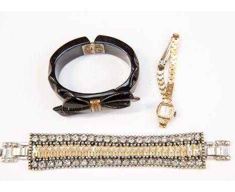  A costume jewellery bracelet by Stella and Dot, yellow and white metals and paste stones, together with a Whitby Jet bangle 