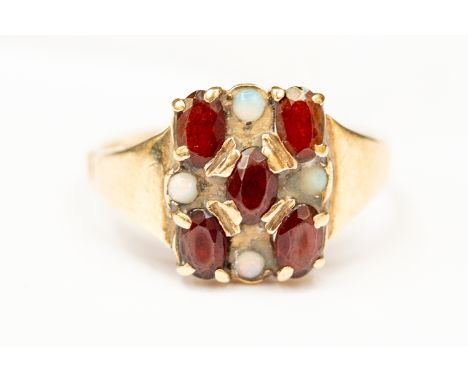 A garnet and opal 9ct gold dress ring