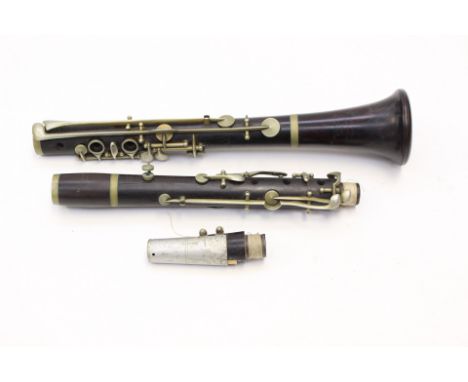 A Boosey &amp; Co rosewood clarinet in a leather military type case