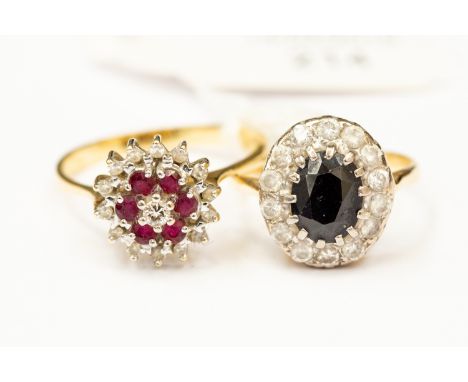 A ruby and diamond cluster ring and another cluster ring (2) 