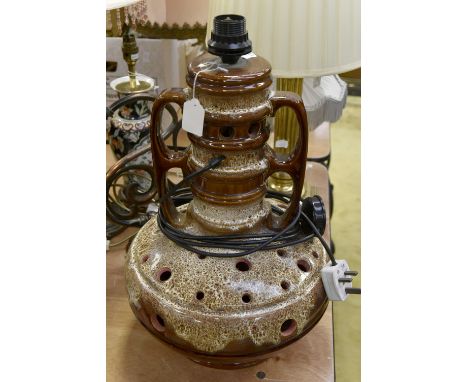 A West German earthen ware lamp, circa 1960's, having bulbous pierced base and elongated twin handles to neck, 46 cms high x 