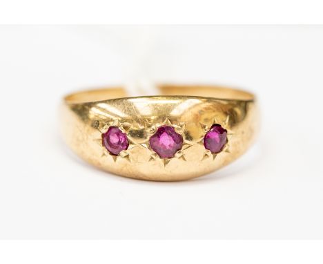 A ruby and 9ct gold ring, star set with three round cut rubies, size approx R, total gross weight approx 3.2gms 