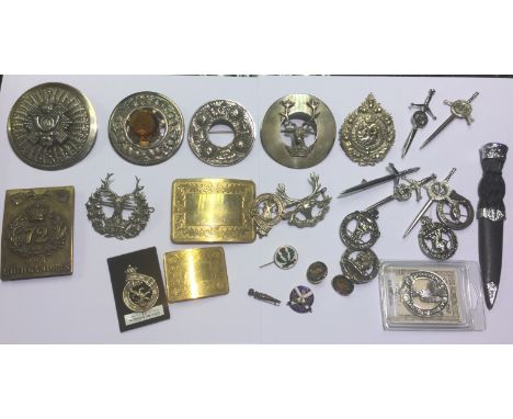 A box of Scottish belt buckles, Clan brooches, enamel membership badges, kilts pins, boxed Sgain Dubh, Scottish Regt cap badg