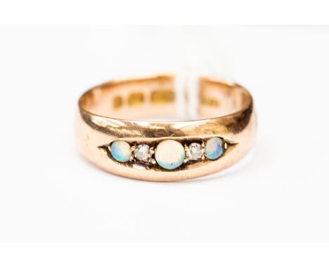 An opal and diamond ring, 9ct gold mount set with three opals with two diamond accents, size M,  green accents, size M, total