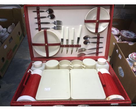 A vintage picnic set (four piece) with Brexton bottles, in red case 