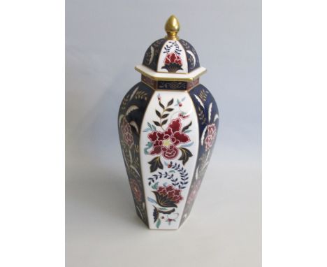 A Royal Worcester Hand Painted Prince Regent 'Hancock Panelled Vase and Cover' Cobalt Blue and white ground . Each panel pain