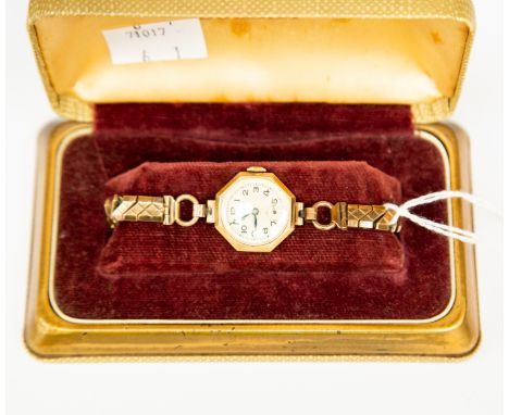 A Summit ladies 9ct gold vintage watch, octagonal dial, numbers and subsidiary dial, on plated bracelet 