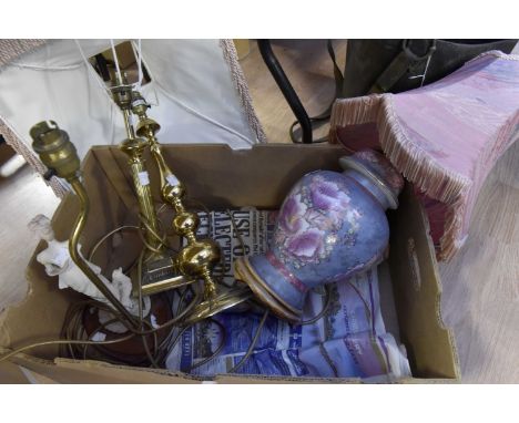 A quantity of brass table lamps, a Chinese ceramic lamp and a Continental lamp in the form of a lady (Parian style) on wooden