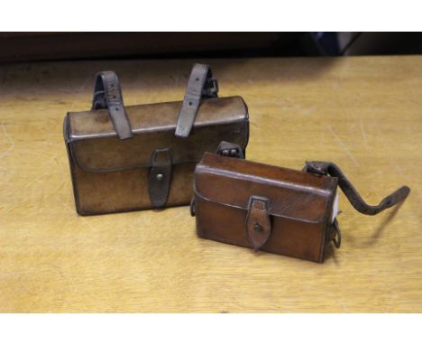 Equestrian/Hunting Interest: Two vintage leather saddle bags, one with interior sandwich tin (2)