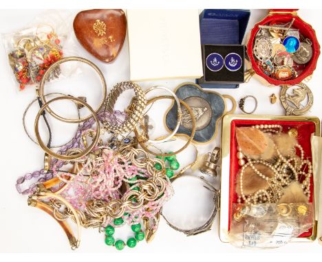 A collection of costume jewellery to include a Monet paste set necklace, glass bead necklaces, gilt and white metal bangles, 