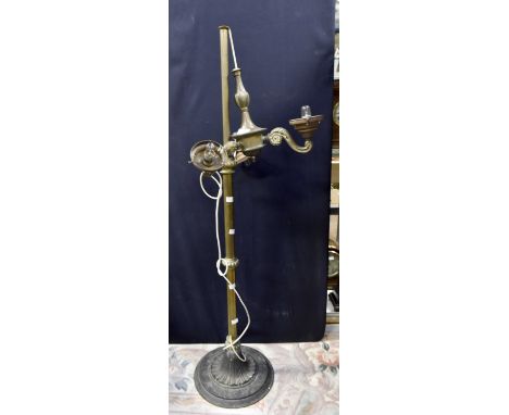 Brass three branch standard lamp with wrought iron base.