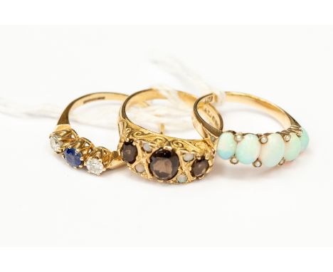 Three 9ct gold dress rings, comprising a Victorian opal and smoky quartz ring, size M1/2, an opal and seed pearl set ring, si