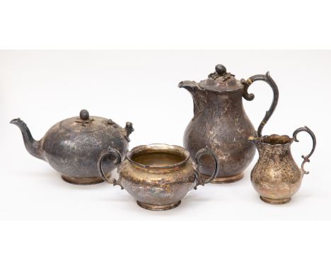 An early Victorian Chinoiserie silver teaset comprising; teapot, hot water jug, milk jug, and sugar bowl, engraved with figur