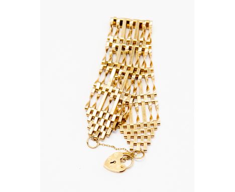 A 9ct gold seven link gate bracelet, straight and twist links,  padlock clasp, weight 13.8 grams approx
