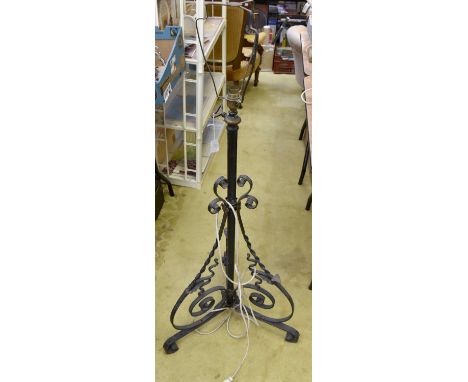 An early 20th century stand up, converted oil lamp