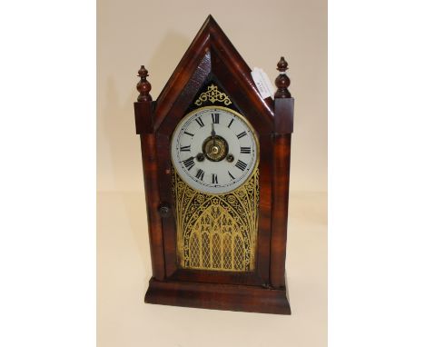 A late 19th early 20th Century American rosewood veneered mantel clock, Gothic design by Jerome &amp; Co, New Haven - white e