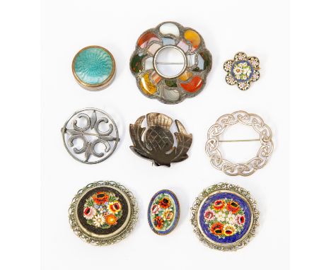 A Victorian Scottish hardstone brooch unmarked white metal, along with four micro mosaic brooches one stamped Italy, and two 