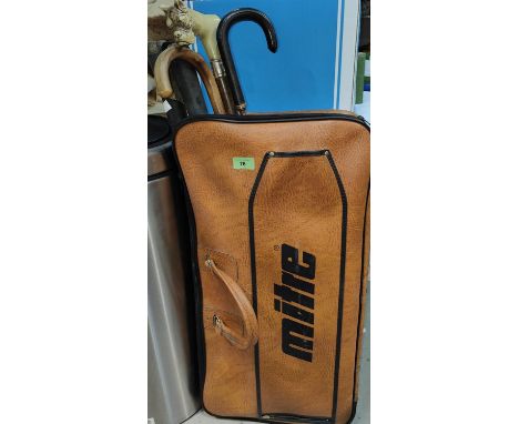 A sports bag with vintage cricket equipment; a walking stick with dog's head handle; etc. 