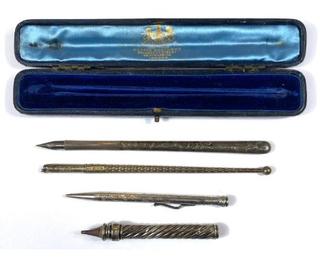 A cased silver ink dip fountain pen, another Art Nouveau and two pencils 