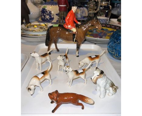 A Beswick hunting group:  mounted huntsman, 5 hounds, fox, etc. 